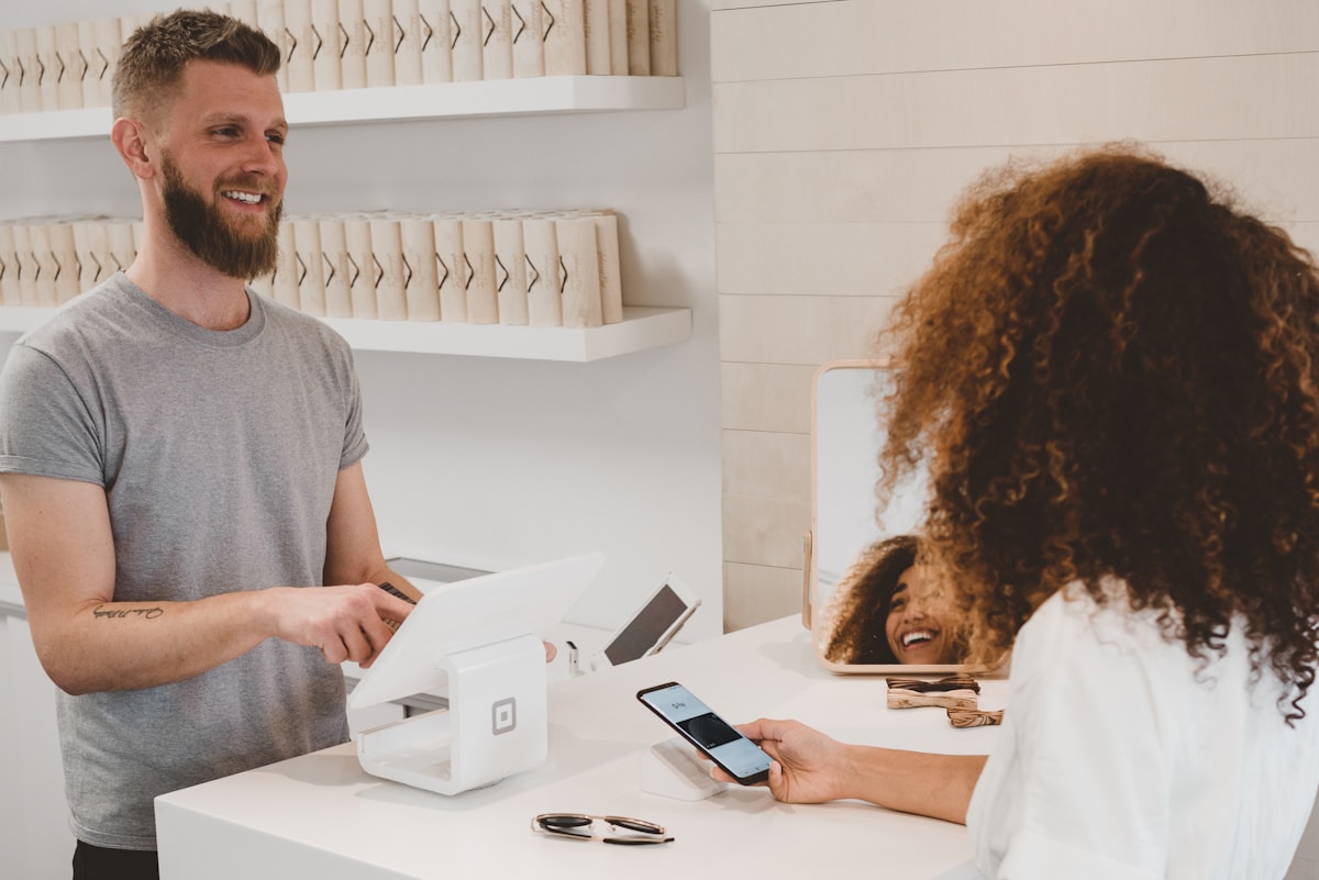 In-person card payment at a business register.